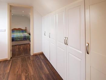 Landing with wardrobes and double bedroom